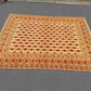 Floor scene with red and beige oriental tribal wool rug