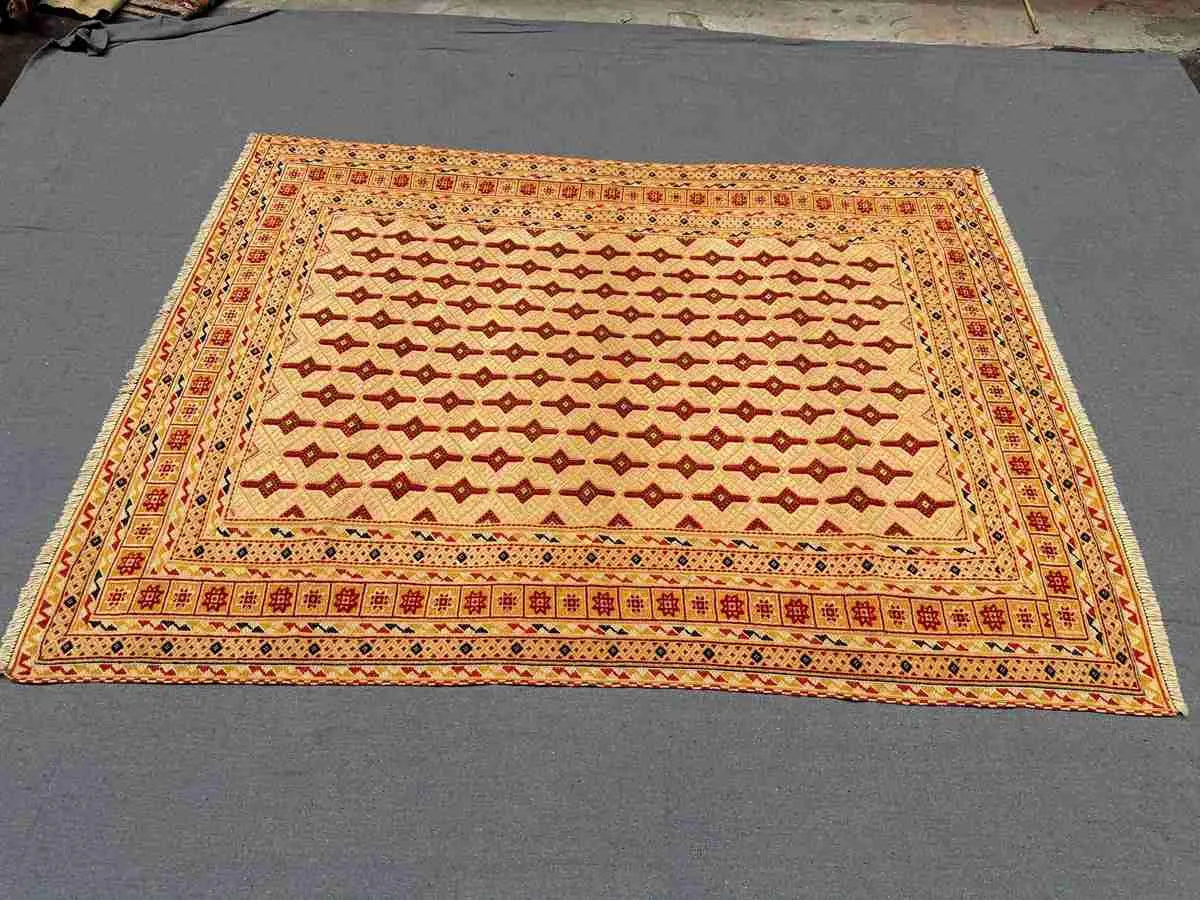 Floor scene with red and beige oriental tribal wool rug