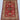 Full view of handmade red Turkish wool rug displayed on modern floor