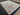 Large 9x12 Oushak rug displayed on hardwood floor