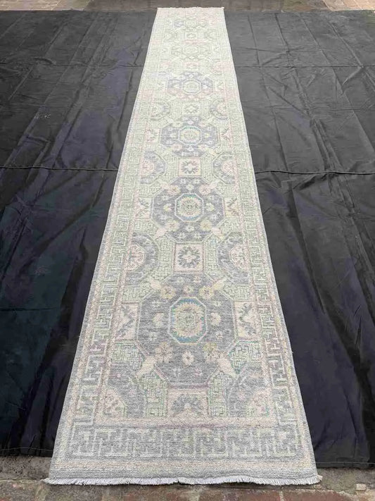 Extra long pastel wool runner rug styled in corridor