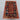 3x4 red and navy handmade Pazyryk rug styled in a small room