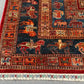 Corner detail of handmade Pazyryk wool rug – geometric tribal art