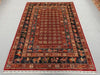 Authentic Pazyryk rug on floor in living room – tribal decor style