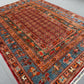 Multicolor red and blue detail of Pazyryk wool carpet on floor