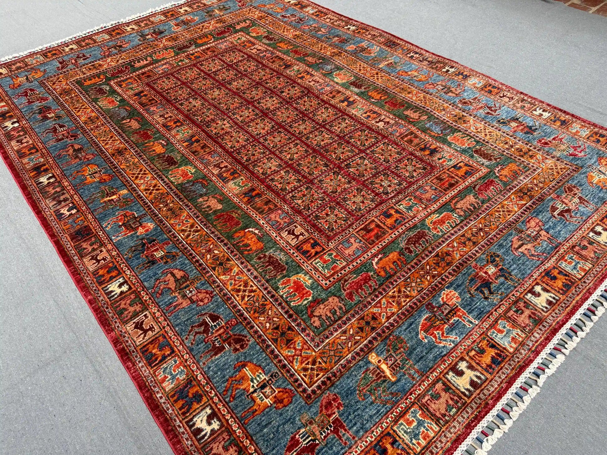 Multicolor red and blue detail of Pazyryk wool carpet on floor