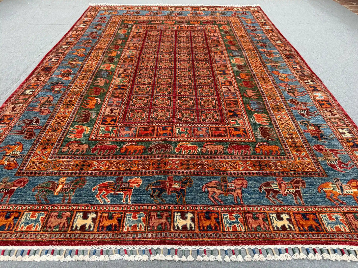 Multicolor red and blue detail of Pazyryk wool rug on floor