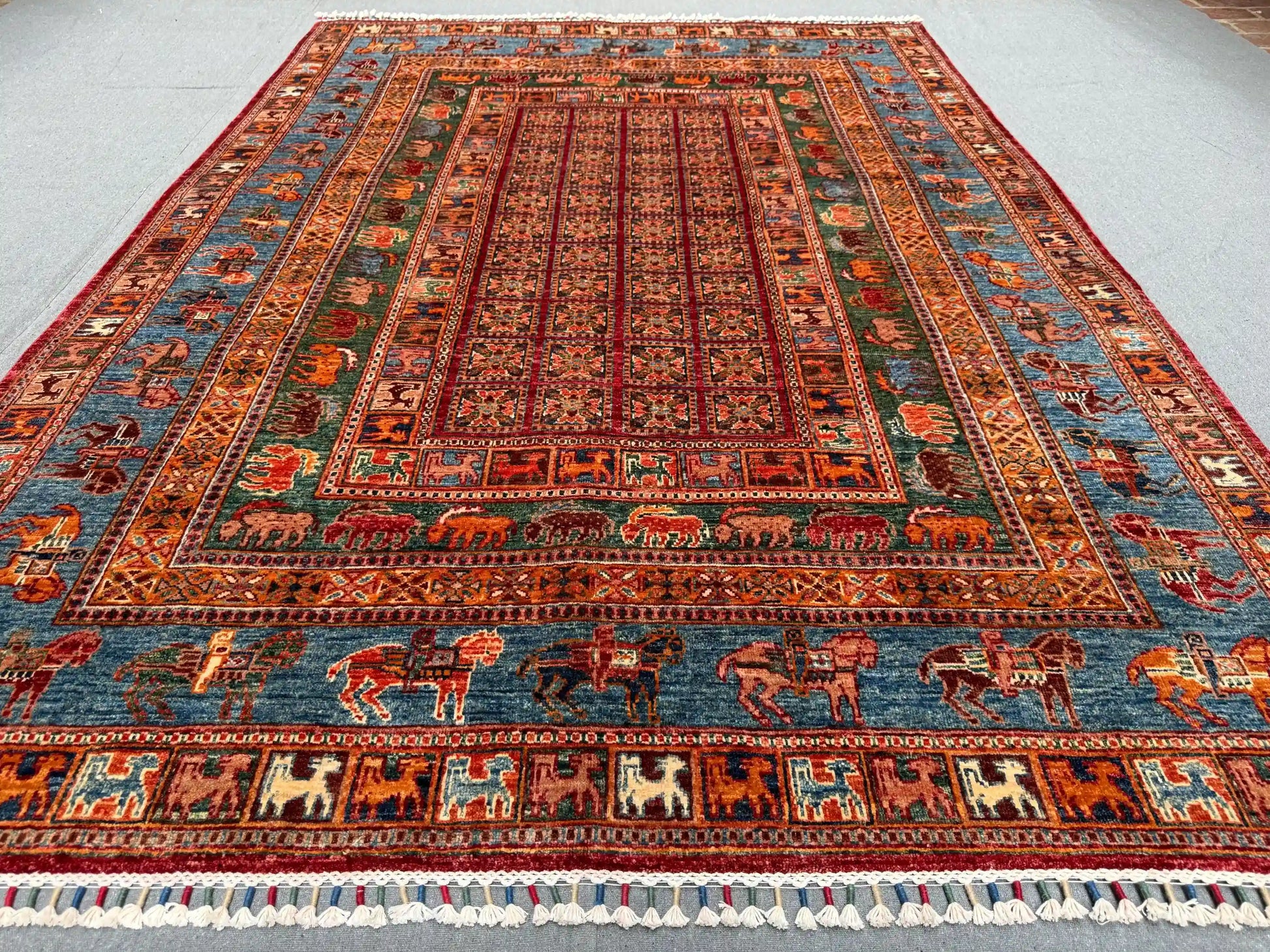 Multicolor red and blue detail of Pazyryk wool rug on floor