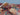Folded edge and texture detail of colorful Persian-style patchwork rug
