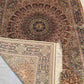Backside folded view of Persian handmade silk area rug