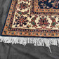 Corner detail of Persian-style handmade Chobi rug