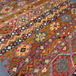 Persian-style Khorjin rug in modern room setting – colorful 8x11 handmade flatweave.