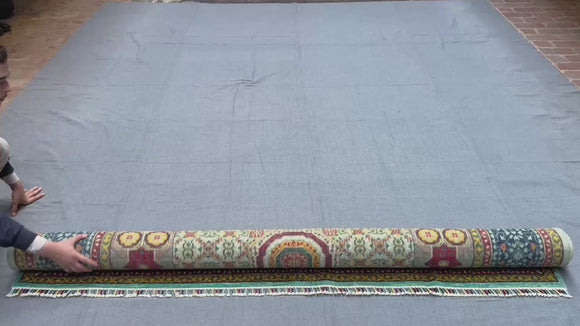 A detailed video showcasing the hand-knotted texture, vibrant multicolor wool and silk fibers, and intricate patterns of the 7x10 handmade Oriental rug.