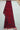 Folded view of hand-knotted red wool Afghan runner