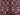Close-up of red and beige Afghan wool silk rug with geometric pattern