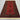 Handmade red and black Turkish rug placed on living room floor