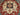 Close-up of floral medallion pattern on Red & Blue Heriz wool rug