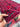 Red & Blue Khamiyaab runner held in hands showing wool texture