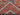Folded Red & Blue Mamluk wool rug showing thickness and quality