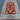 Red and blue Ziegler rug laid out on wooden floor in traditional setting