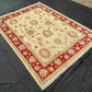 Red and cream Chobi wool rug styled in living room decor