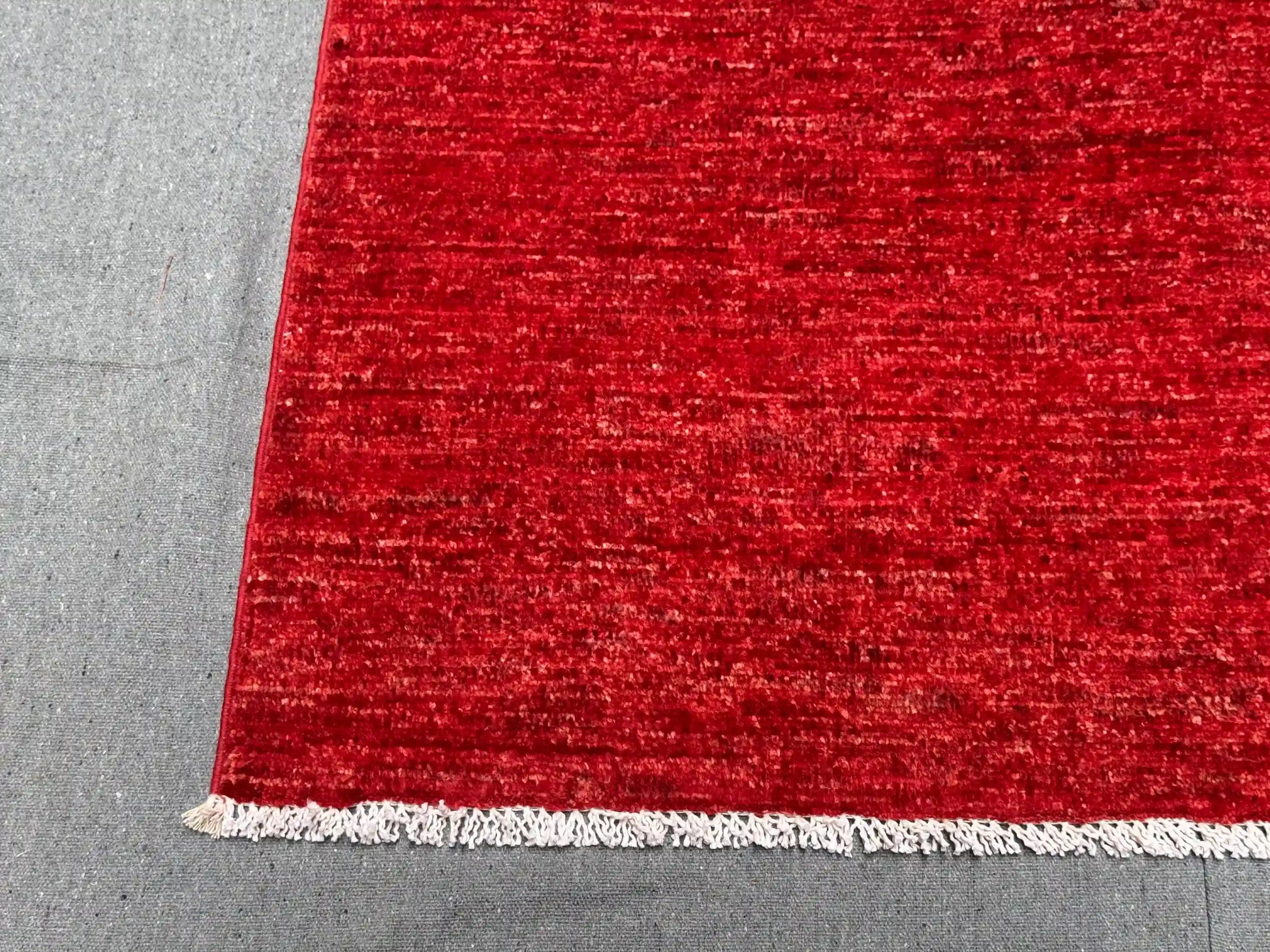 Close-up of knotted weave on Red Gabbeh Wool Rug – Persian design