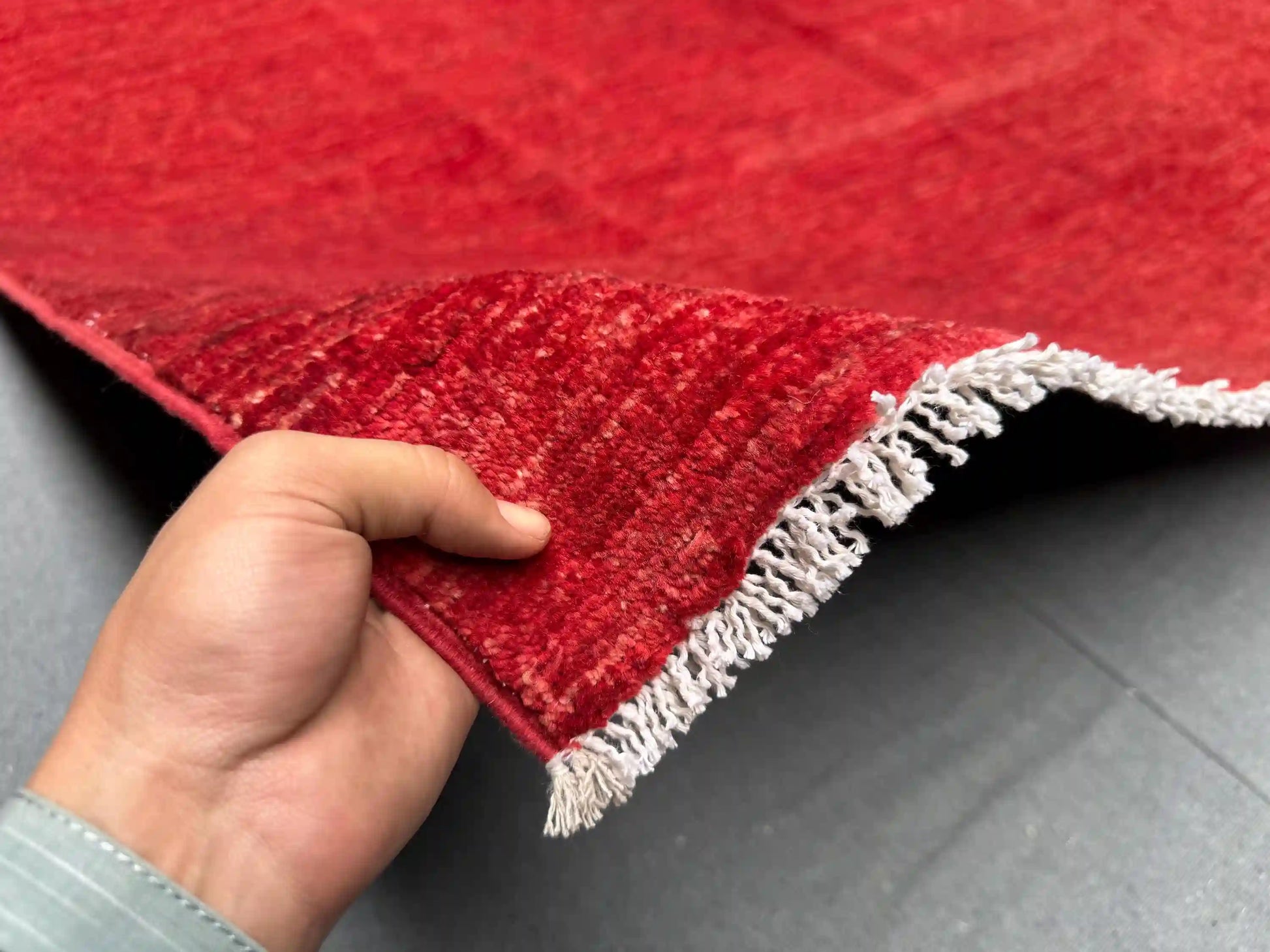 Handmade Red Gabbeh Rug 6.6x9.7 ft in hands – Persian Wool Carpet