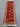 Wool Gabbeh tribal rug in interior space – vibrant red tones