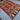 Angle view of red handmade Kilim rug on living room floor