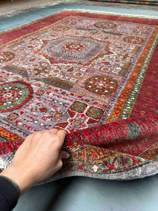 Red Mamluk wool rug shown in hands – Turkish handmade carpet