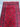 Detailed shot of tribal geometric pattern on handmade red wool runner rug.