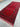 Detailed shot of tribal geometric pattern on handmade red wool runner rug.