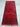 Red tribal runner rug placed in hallway setting—perfect for narrow spaces.
