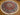 6ft hand-knotted silk rug used in living room setting