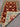 Handwoven Turkish red rug partially folded showing backside knots