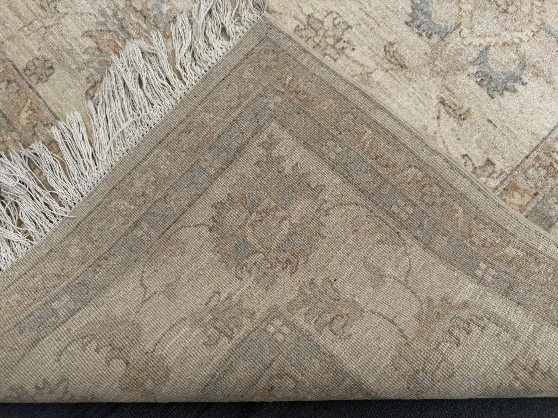 Back view of folded Ziegler rug showing fine knotted craftsmanship
