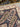 Silk weave and knot detail shown on folded Persian-style rug