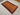 Rustic room setting with handmade wool Baluchi rug as floor centerpiece