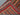 Folded handmade rug highlighting striped multicolor patterns