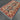 Side angle view of Turkish red and blue wool rug on floor