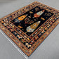 Side angle of handmade Tree of Life rug on hardwood floor