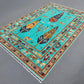 Side angle of turquoise Tree of Life wool rug on floor