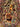 Close-up of horses on 2x3 Persian silk rug with hunting motif.