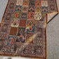 Folded silk patchwork rug showing underside weave