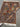 Folded silk patchwork rug showing underside weave
