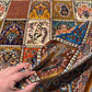 Artisan Silk Patchwork Rug held in hands – soft texture detail