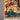 Corner detail of handmade silk wall hanging with bird motif