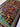 Angle view of Persian-style silk hanging rug on floor