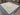 Pastel Turkish Oushak-style Oriental rug laid flat on floor