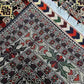 Folded view of handmade Oriental carpet showing soft wool silk texture